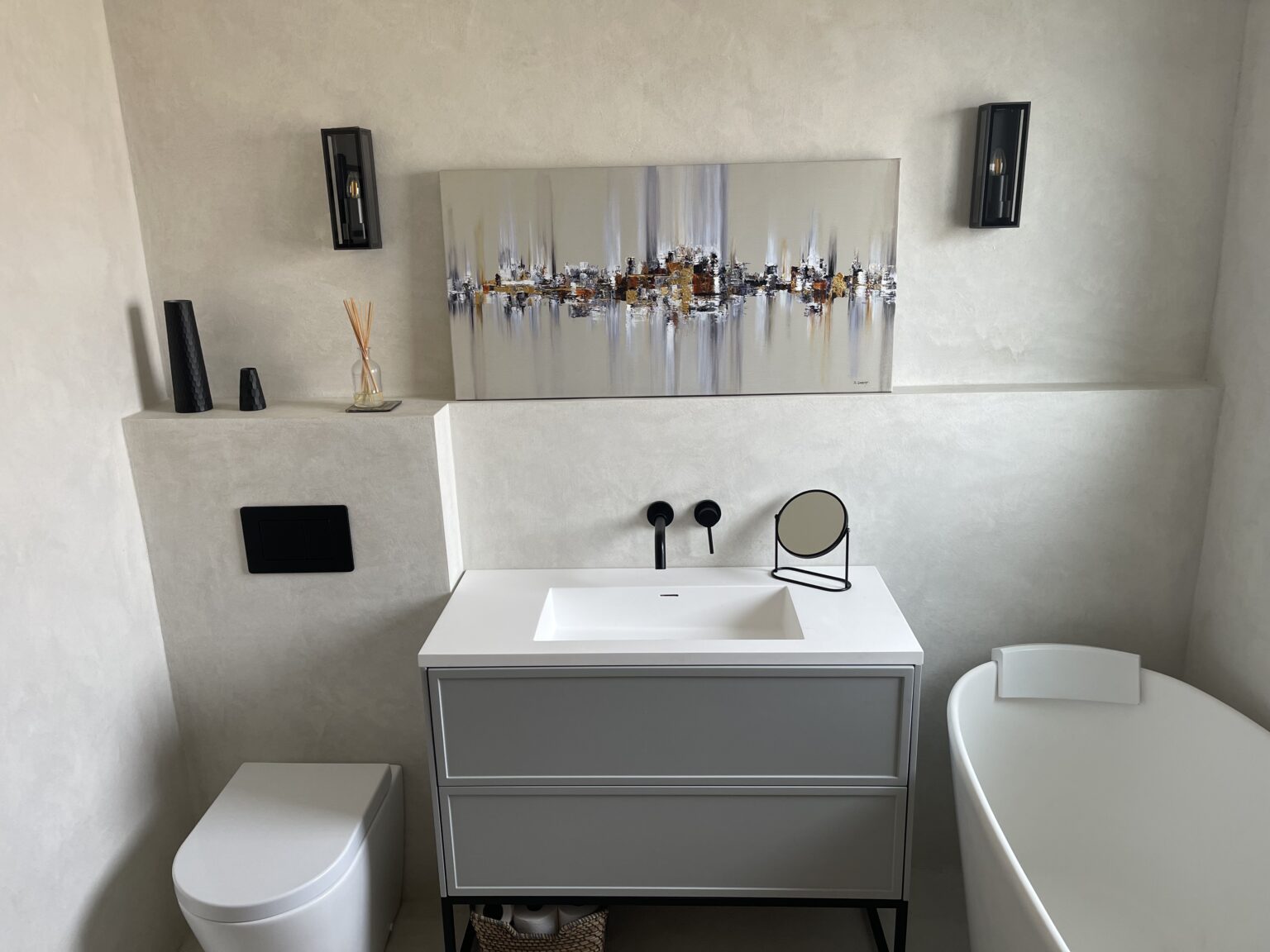 Modern small bathroom following a bathroom refurb in North Shields, featuring a walk-in shower, wall-hung vanity unit, smart storage solutions, and space-saving design installed by a local plumber.